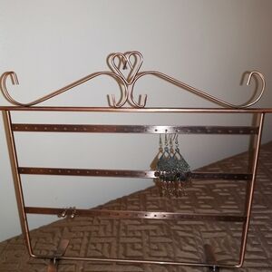 Copper tone earrings display